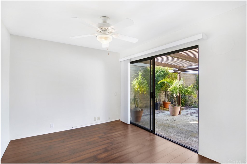 23892 Danzig Bay Dana Point, CA 92629 - Photo 15 of 49 an empty room with wooden floor and windows