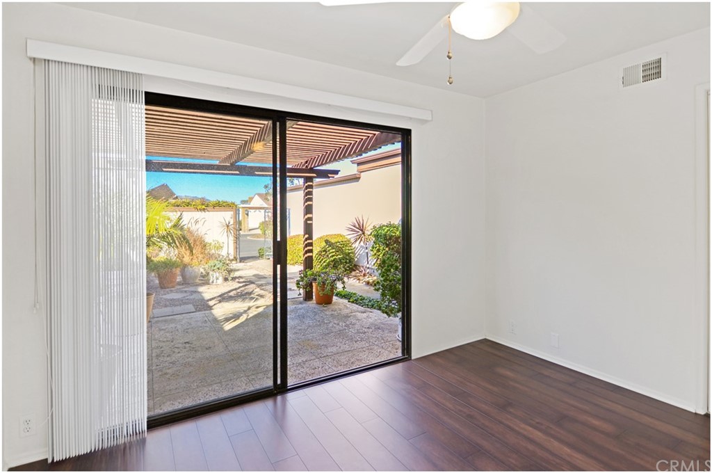 23892 Danzig Bay Dana Point, CA 92629 - Photo 16 of 49 a view of empty room with wooden floor and fan