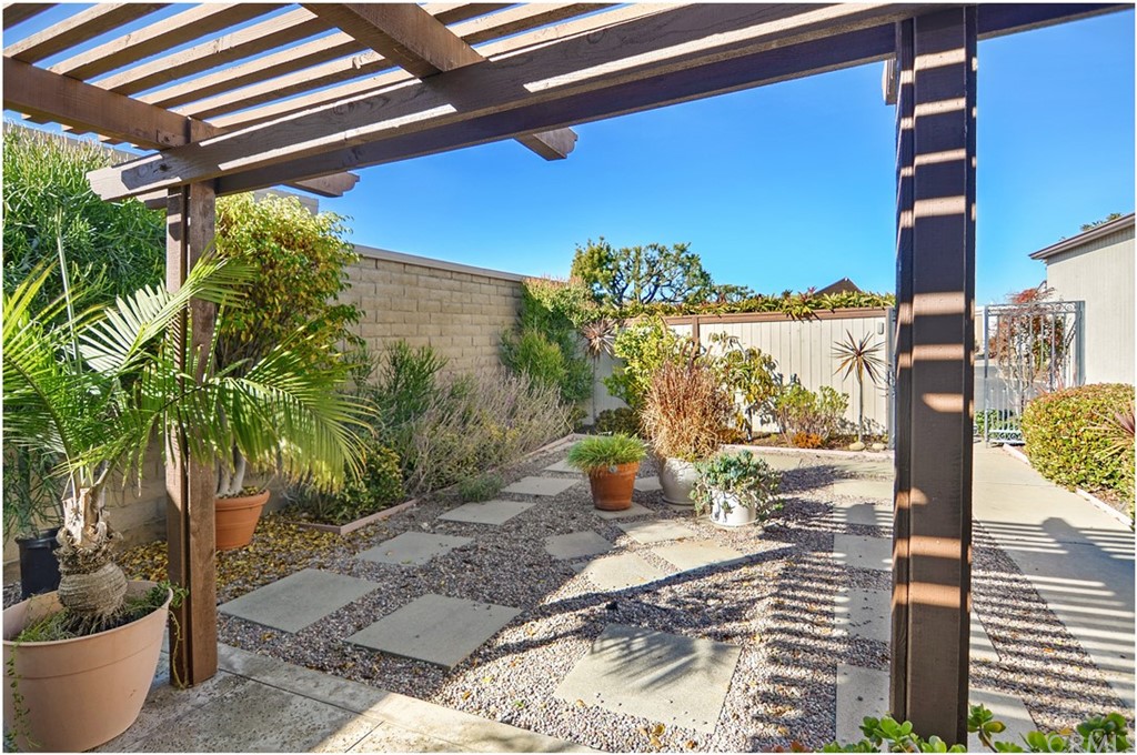 23892 Danzig Bay Dana Point, CA 92629 - Photo 17 of 49 a view of a patio with table and chairs and potted plants