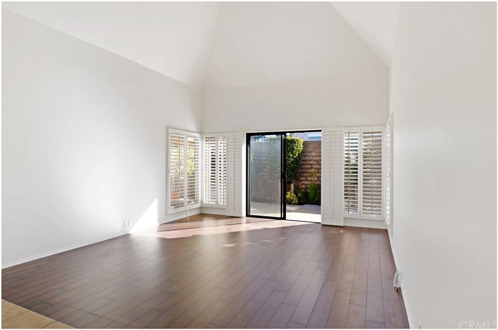 23892 Danzig Bay Dana Point, CA 92629 - Photo 21 of 49 a view of an empty room with wooden floor and a window