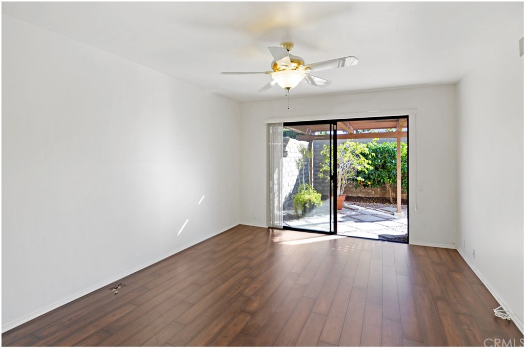 23892 Danzig Bay Dana Point, CA 92629 - Photo 23 of 49 a view of an empty room with wooden floor and a window