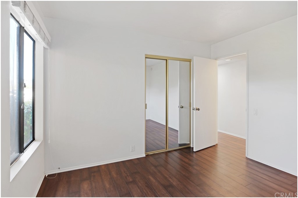 23892 Danzig Bay Dana Point, CA 92629 - Photo 29 of 49 a view of an empty room with wooden floor and a window