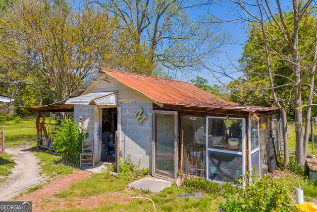 an aerial view of a house with a swimming pool