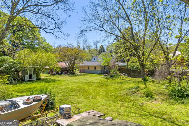 a view of an empty room with glass door