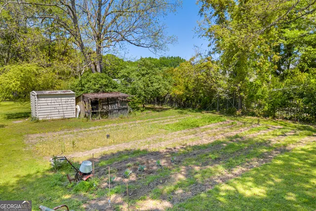 a view of play room with toys and a large window