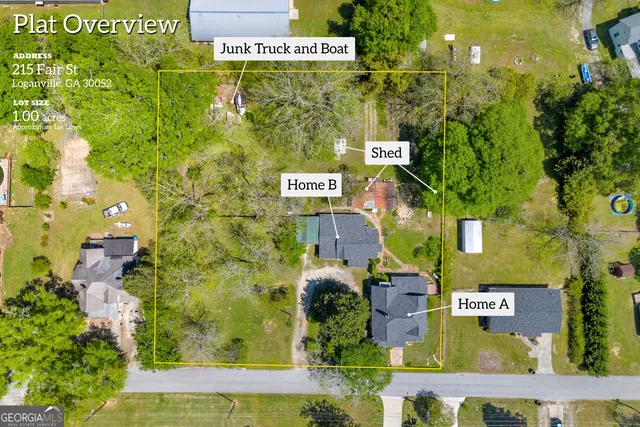 a front view of a house with a yard table and chairs