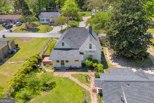 a bedroom with furniture and a fireplace