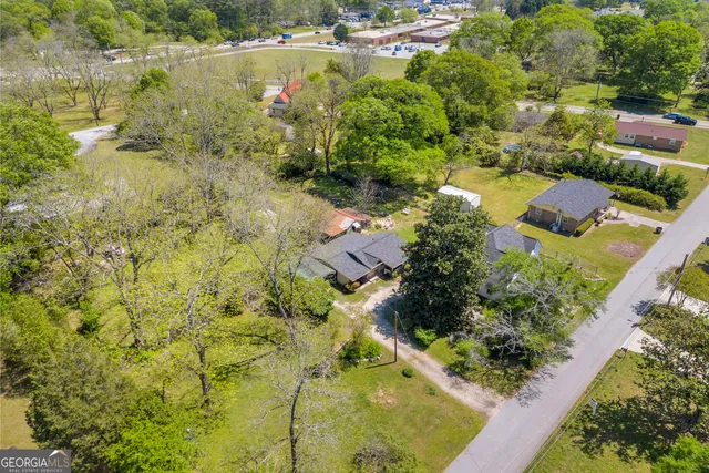 a view of living room with furniture and wooden floor