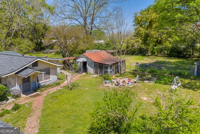 a bathroom with a window and a shower