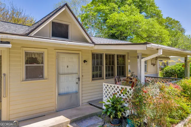 a view of a dining room with furniture and window