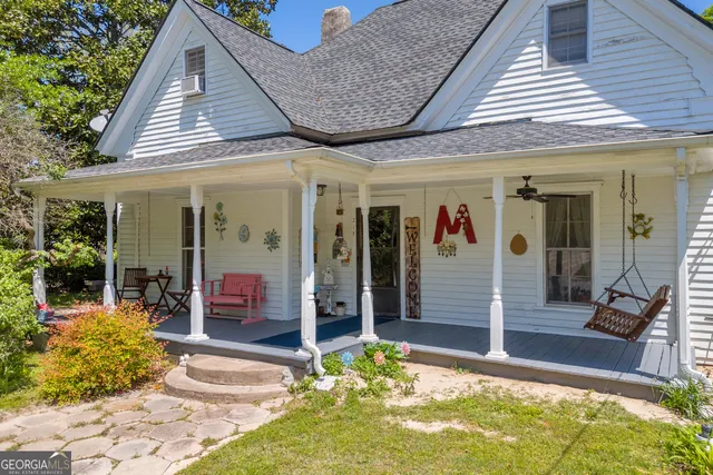 a kitchen with stainless steel appliances a sink a stove and a window