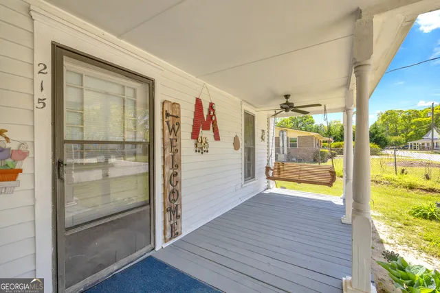 a bathroom with a toilet a sink and a mirror