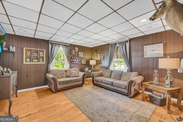 a view of a dining room with furniture and a window