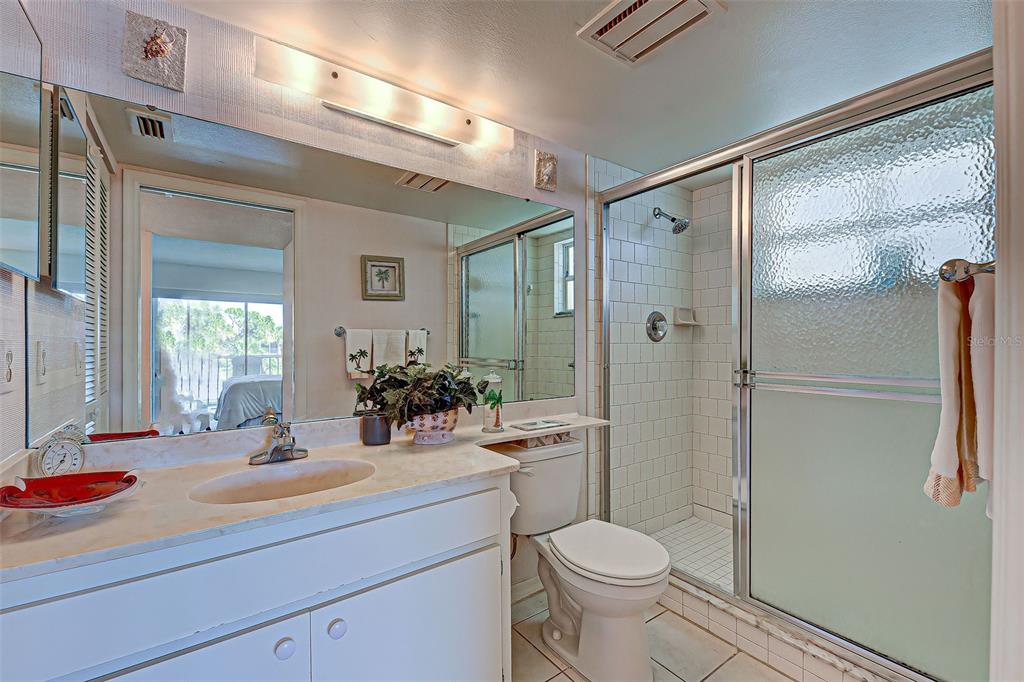 418 Cerromar Court, Unit 261 Venice, FL 34293 - Photo 14 of 76 a bathroom with a sink toilet and shower
