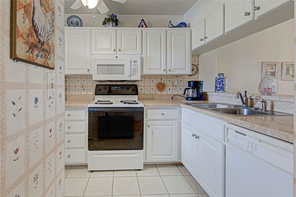418 Cerromar Court, Unit 261 Venice, FL 34293 - Photo 19 of 76 a kitchen with cabinets stainless steel appliances and a sink