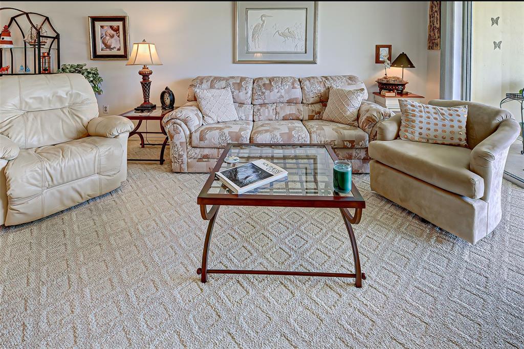 418 Cerromar Court, Unit 261 Venice, FL 34293 - Photo 30 of 76 a living room with furniture and wooden floor