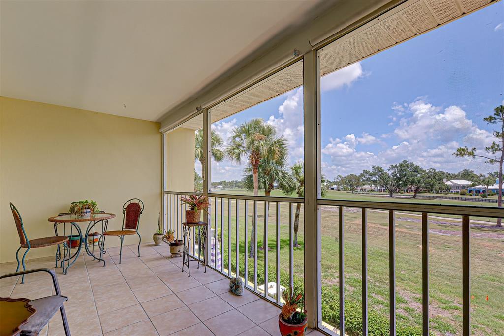 418 Cerromar Court, Unit 261 Venice, FL 34293 - Photo 37 of 76 a view of a porch with a table and chairs in the balcony