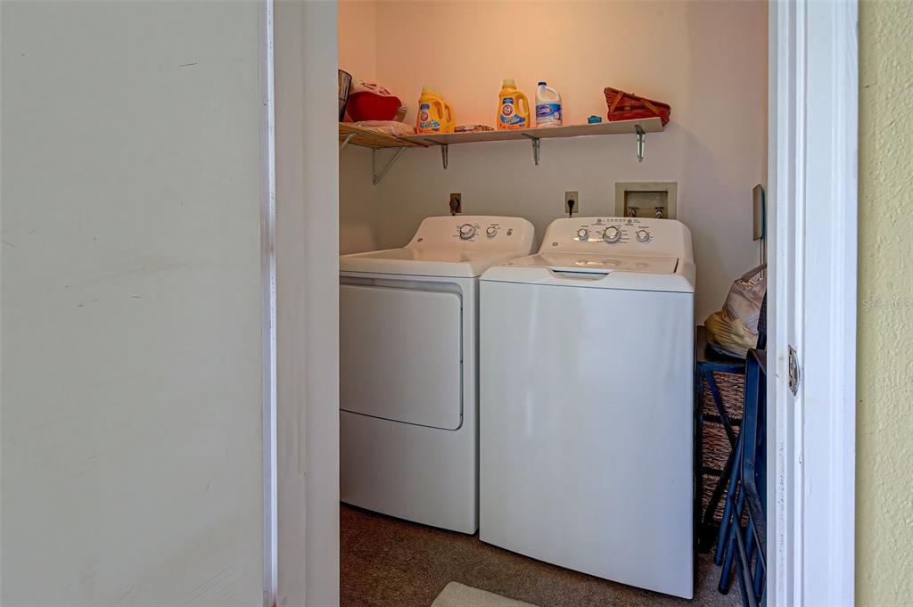 418 Cerromar Court, Unit 261 Venice, FL 34293 - Photo 40 of 76 a utility room with dryer and washer