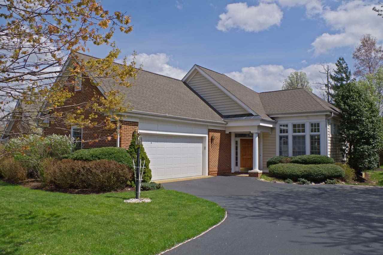 2126 Shepherds Ridge Road Charlottesville, VA 22901 - Photo 1 of 37 a front view of a house with a garden
