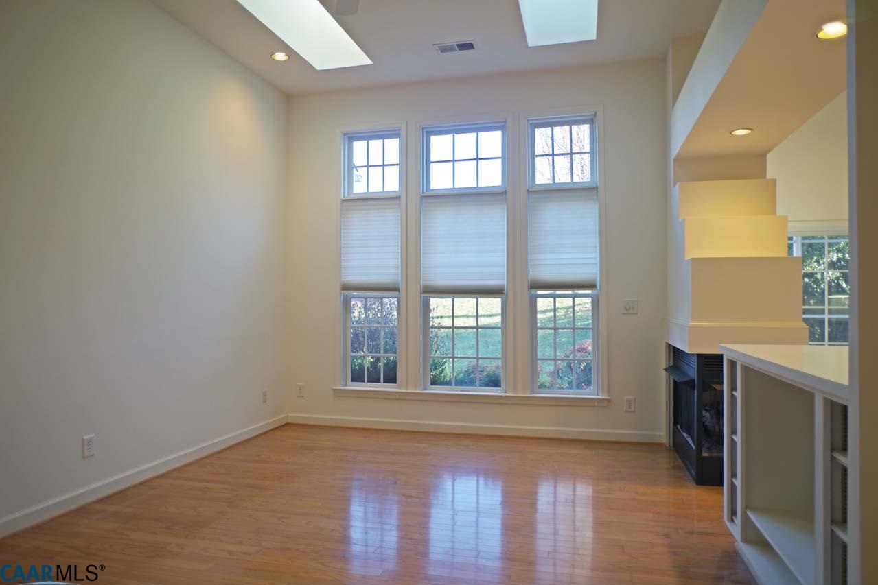 2126 Shepherds Ridge Road Charlottesville, VA 22901 - Photo 15 of 37 an empty room with wooden floor and windows