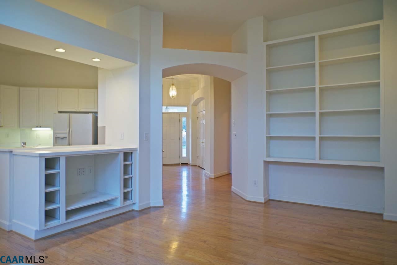 2126 Shepherds Ridge Road Charlottesville, VA 22901 - Photo 17 of 37 a view of kitchen and empty room with wooden floor