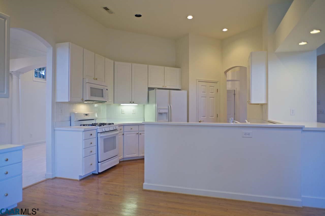 2126 Shepherds Ridge Road Charlottesville, VA 22901 - Photo 18 of 37 a kitchen with stainless steel appliances granite countertop a sink and cabinets