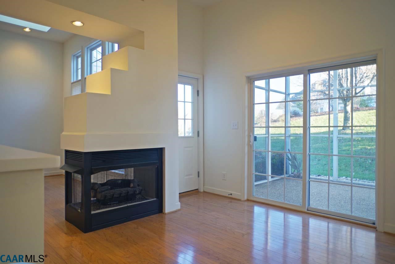 2126 Shepherds Ridge Road Charlottesville, VA 22901 - Photo 23 of 37 a living room with furniture and a fireplace