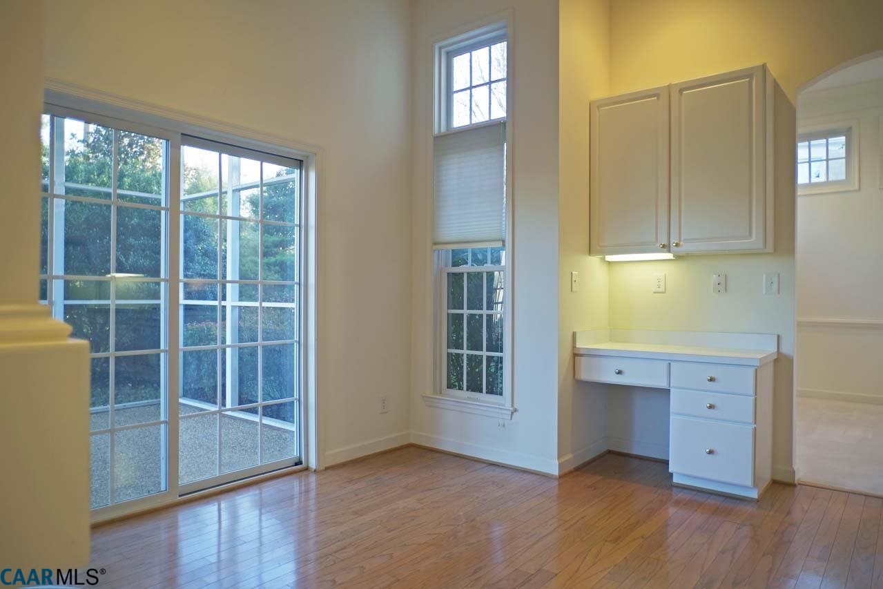 2126 Shepherds Ridge Road Charlottesville, VA 22901 - Photo 24 of 37 a view of an empty room with wooden floor and a window