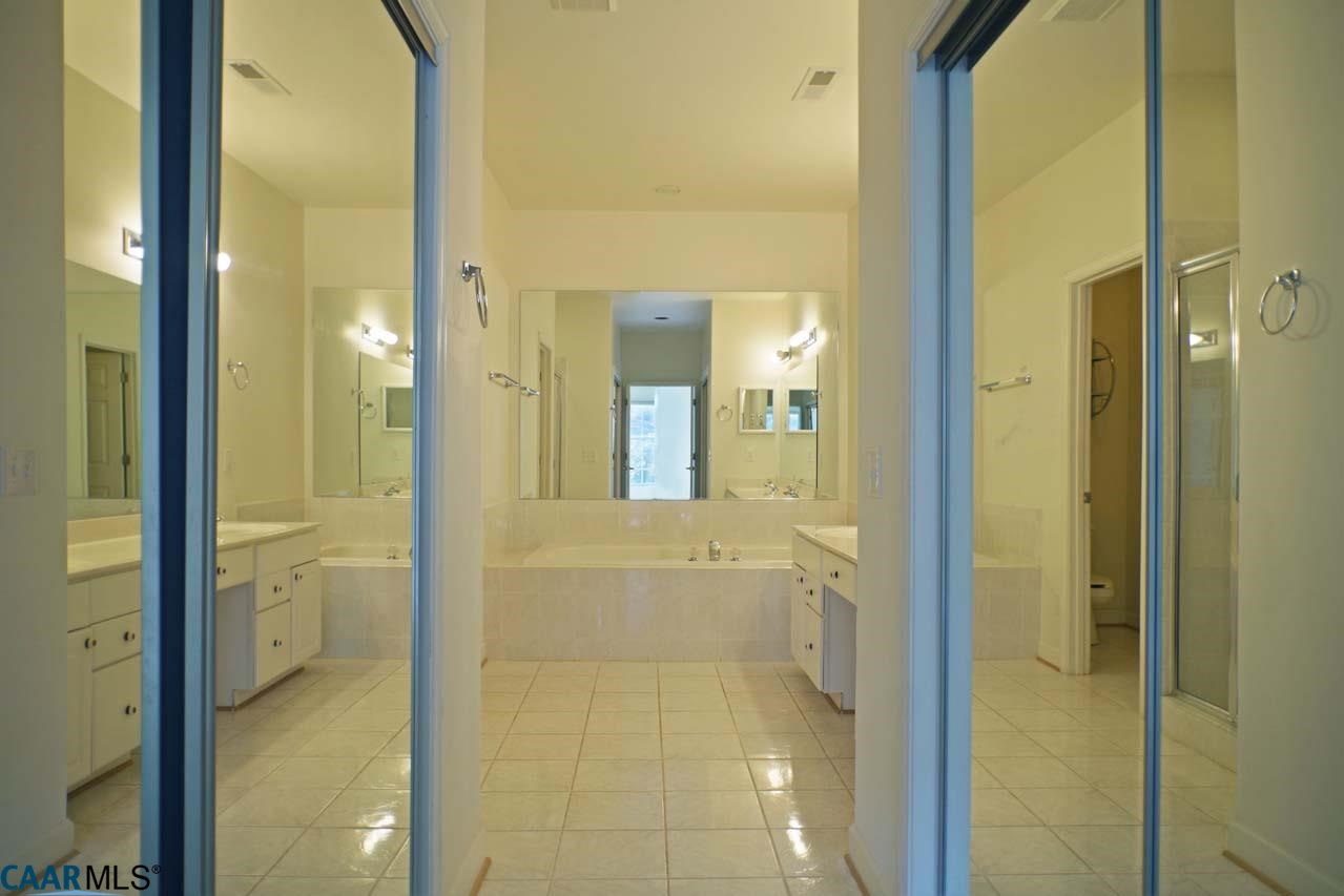 2126 Shepherds Ridge Road Charlottesville, VA 22901 - Photo 30 of 37 a bathroom with a bathtub and a shower