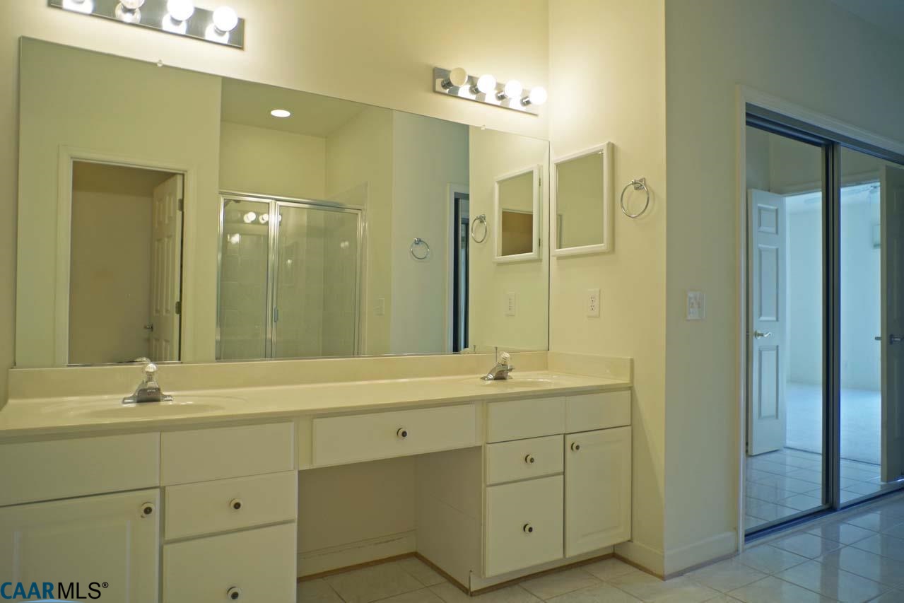 2126 Shepherds Ridge Road Charlottesville, VA 22901 - Photo 32 of 37 a bathroom with a double vanity sink mirror and double