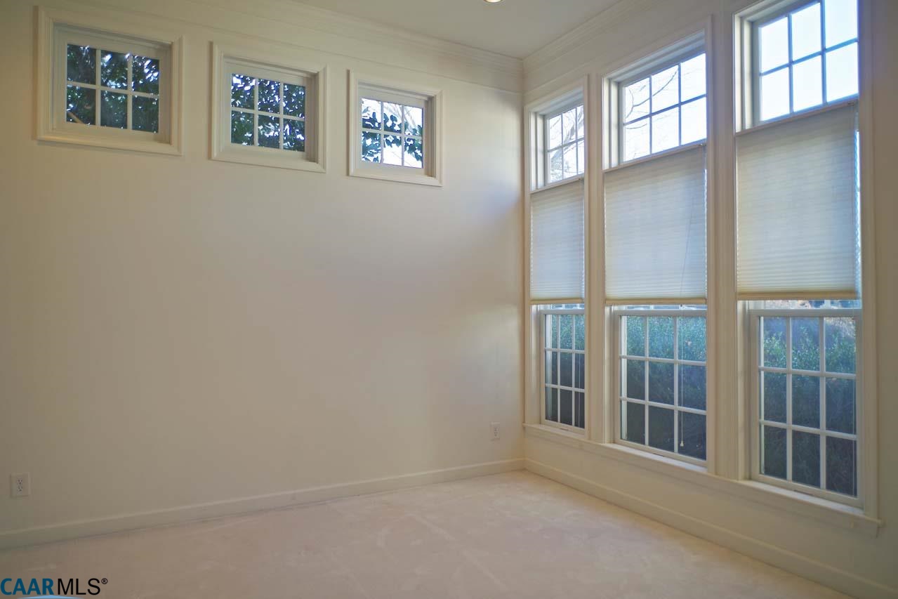 2126 Shepherds Ridge Road Charlottesville, VA 22901 - Photo 7 of 37 a view of an empty room with a window