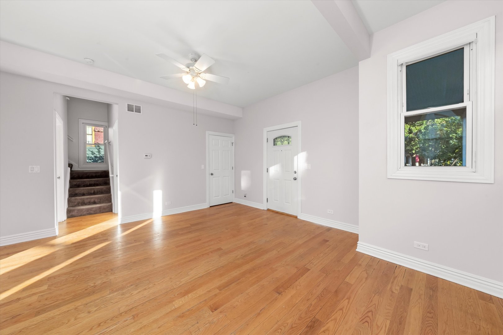 197 Herrick Road Riverside, IL 60546 - Photo 9 of 45 an empty room with wooden floor cabinet and windows