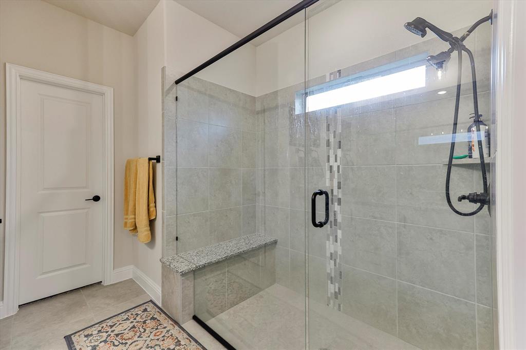 10 Covey Lane Sanger, TX 76266 - Photo 15 of 29 a bathroom with a glass shower door