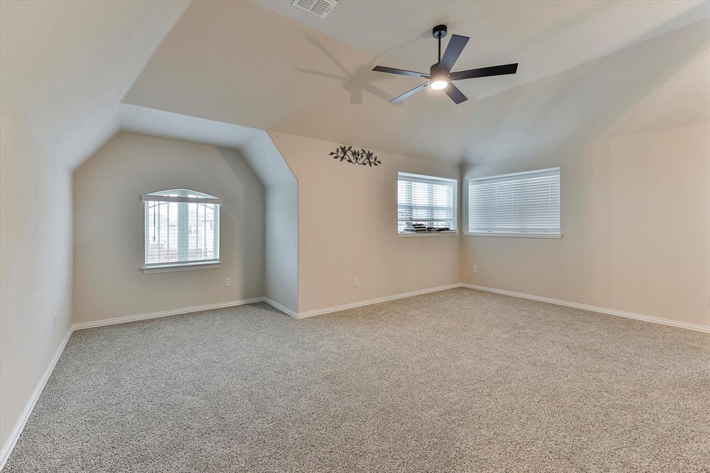 10 Covey Lane Sanger, TX 76266 - Photo 19 of 29 an empty room with windows and ceiling fan