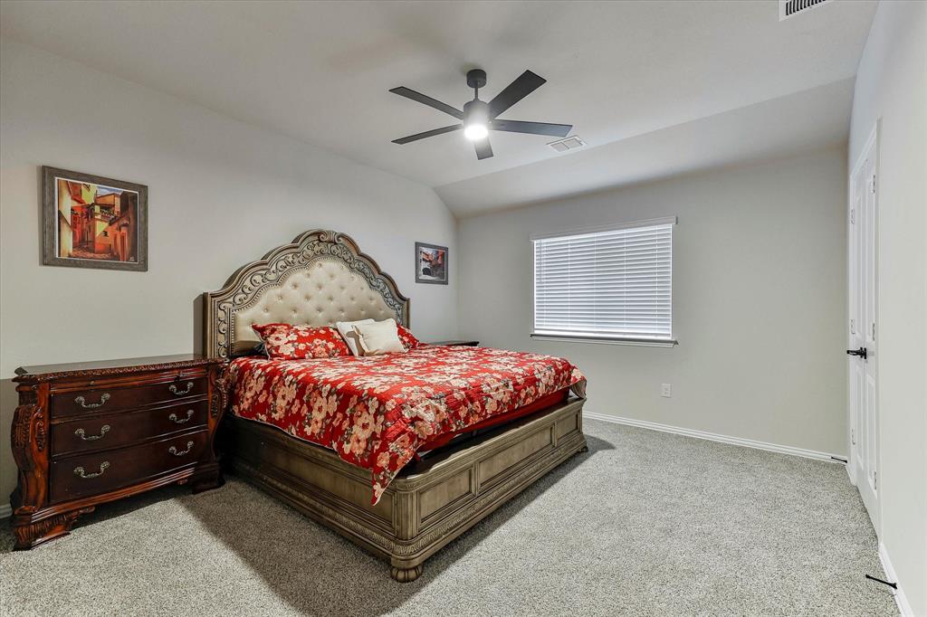 10 Covey Lane Sanger, TX 76266 - Photo 20 of 29 a bedroom with a bed and window