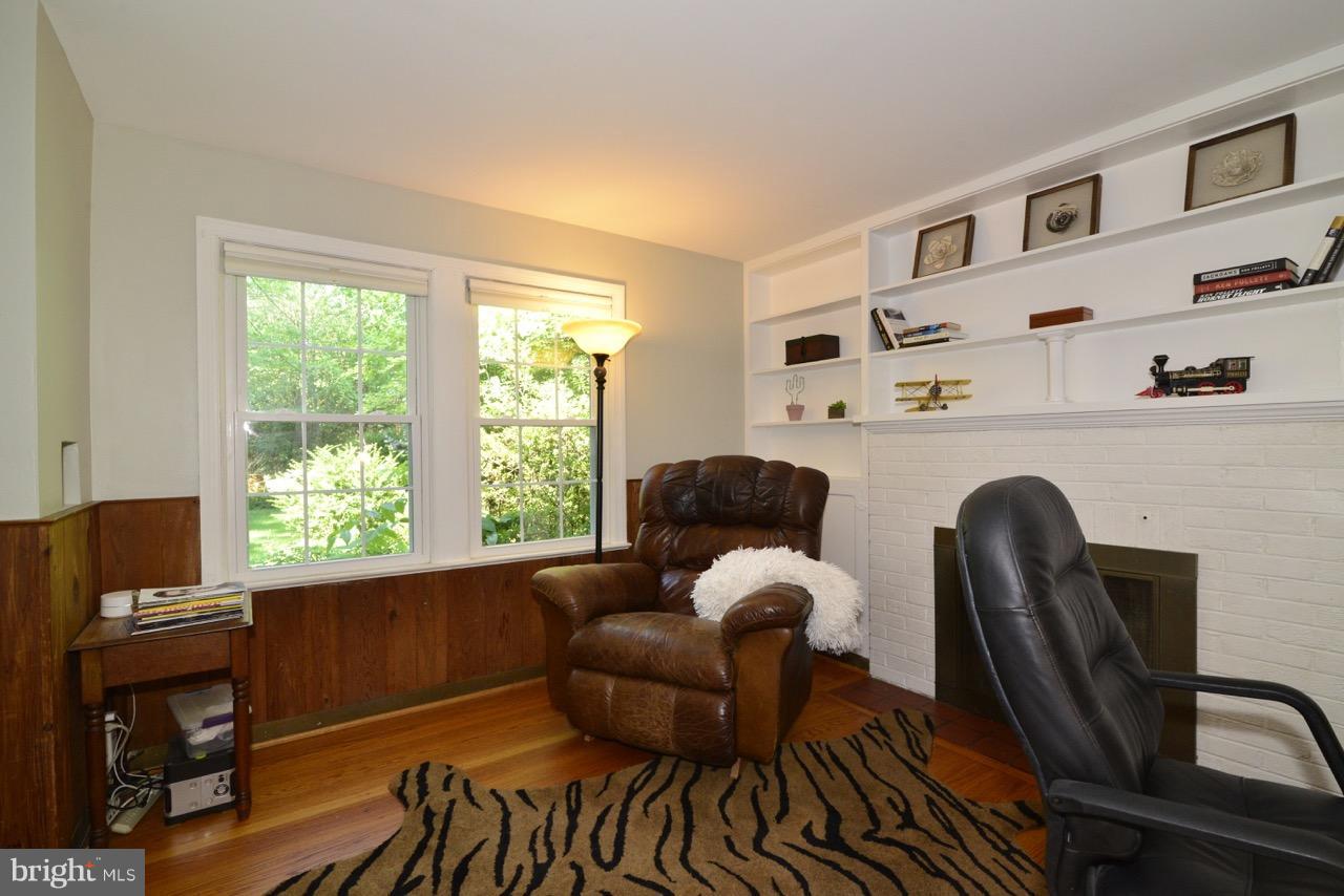 3073 Holmes Run Road Falls Church, VA 22042 - Photo 12 of 29 Home office with fireplace and built-in shelving.