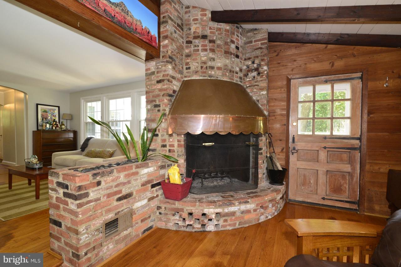 3073 Holmes Run Road Falls Church, VA 22042 - Photo 9 of 29 All brick fireplace with access to patio.