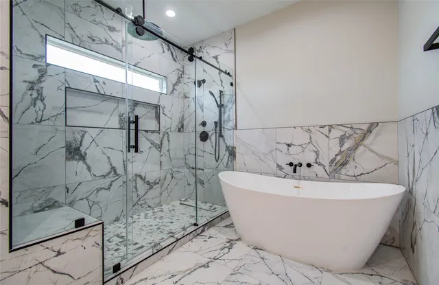 a white bath tub sitting in a bathroom