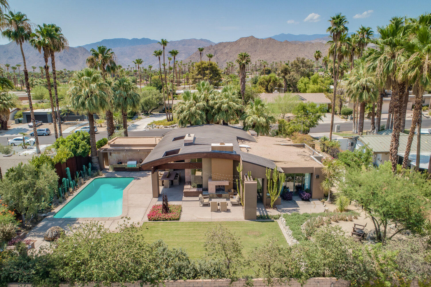 73580 Broken Arrow Trail Palm Desert, CA 92260 - Photo 2 of 40 an aerial view of a house with swimming pool garden and patio