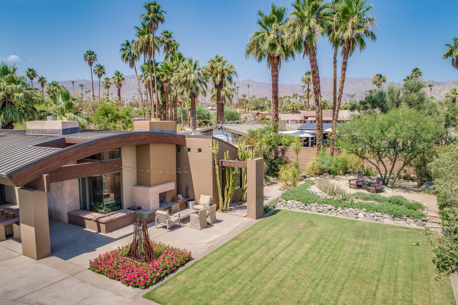 73580 Broken Arrow Trail Palm Desert, CA 92260 - Photo 14 of 40 a view of a backyard with plants and palm tree