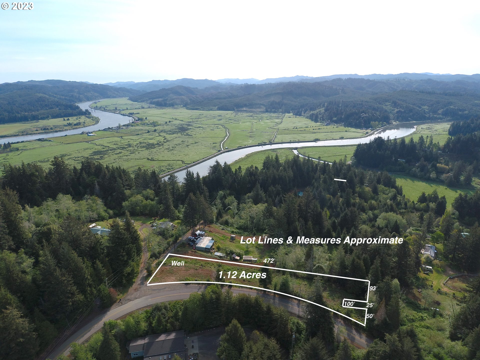 0 Isthmus Heights Road Coos Bay, OR 97420 - Photo 1 of 16 a view of a lake with a mountain in the background