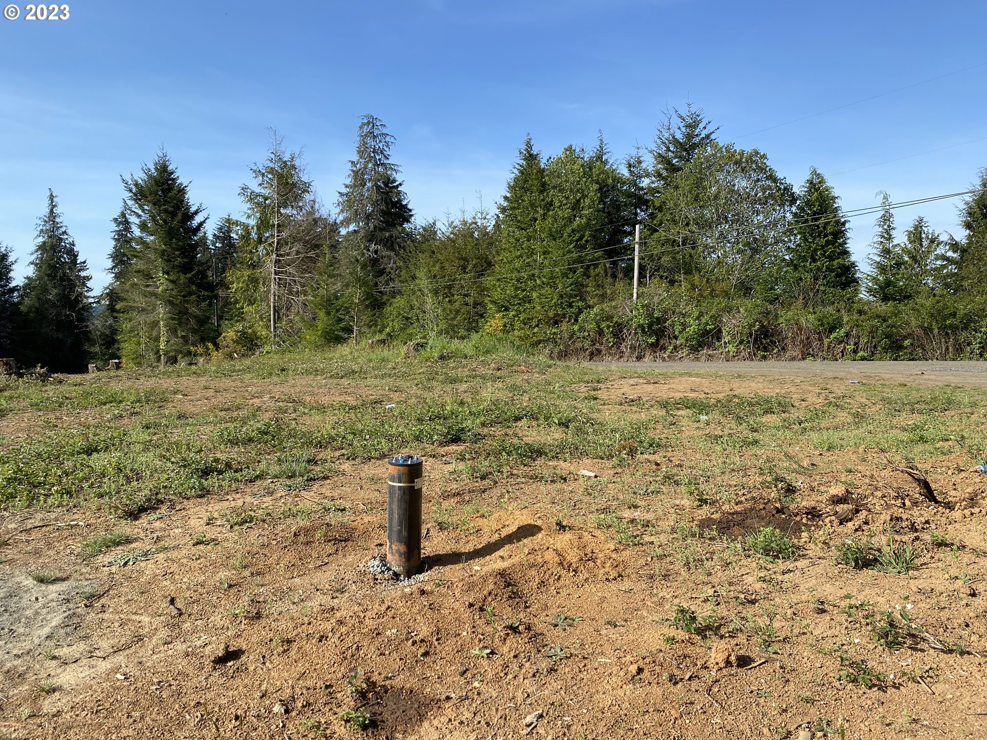 0 Isthmus Heights Road Coos Bay, OR 97420 - Photo 4 of 16 a view of a field with trees in the background