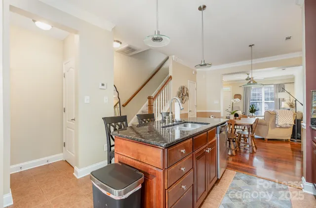 a kitchen that has a table and chairs in it