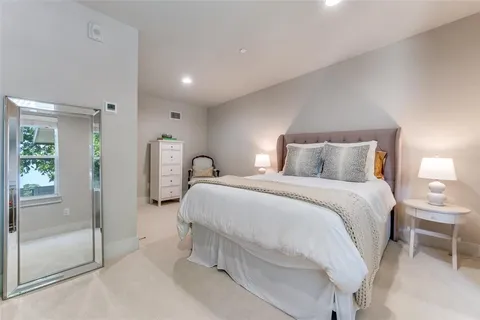 a bedroom with a bed and a walk in closet