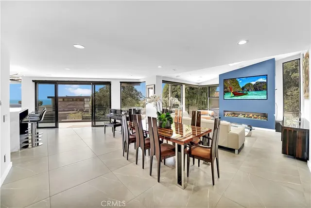a view of a dining area with furniture and chandelier