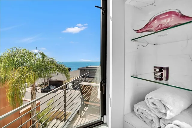 a view of city from balcony with seating space