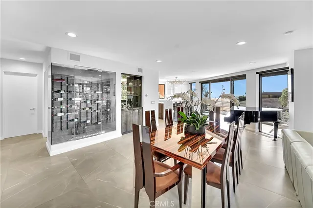 a dining room with furniture and glass table