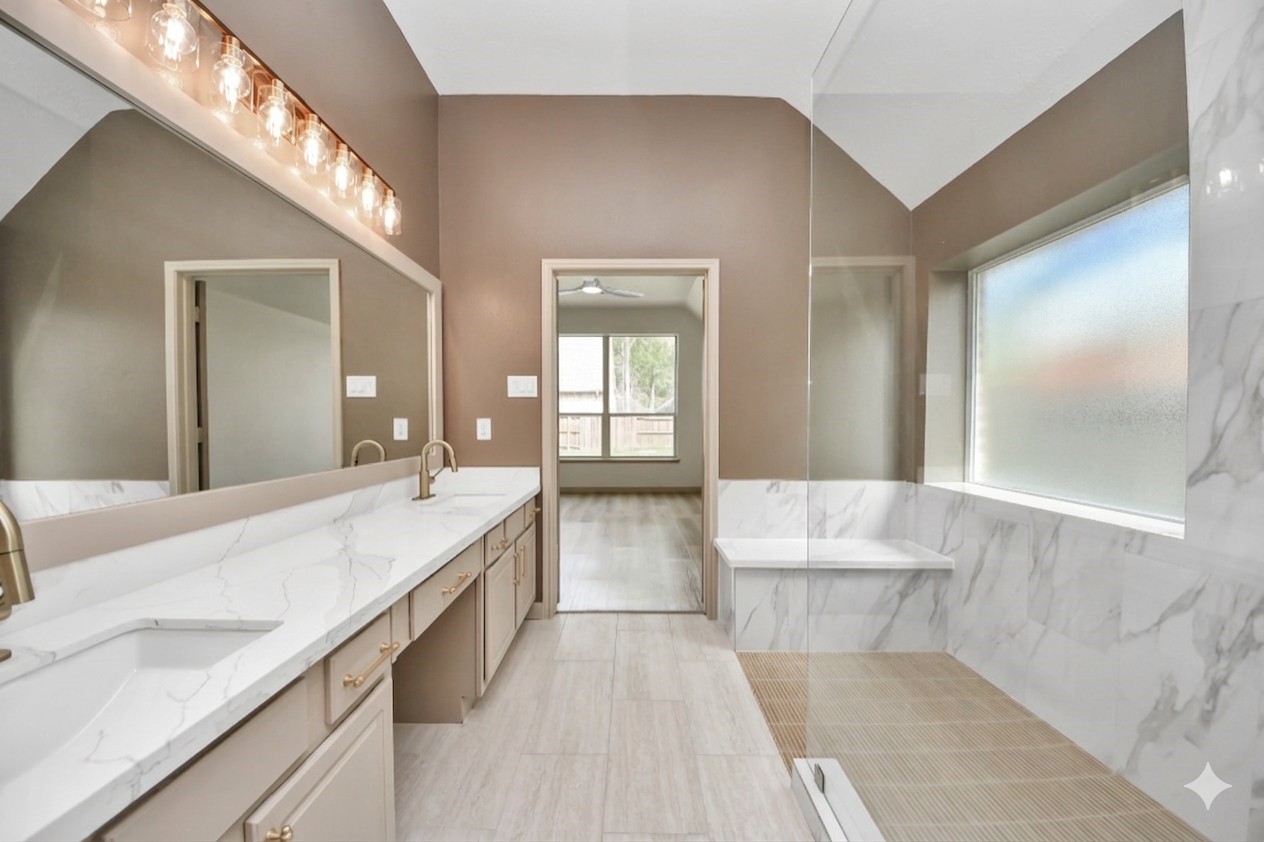 14423 Gadwall Court Houston, TX 77044 - Photo 34 of 42 a spacious bathroom with a granite countertop tub sink and mirror