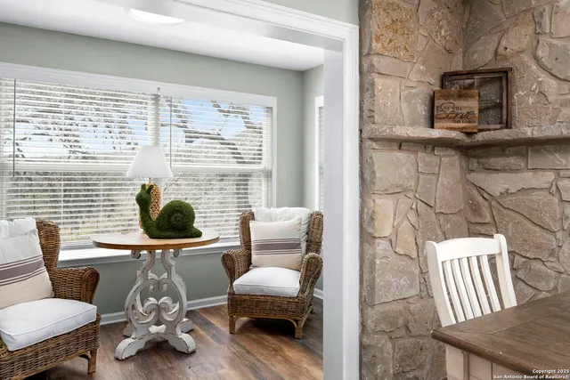 a bathroom with a toilet a sink and a mirror