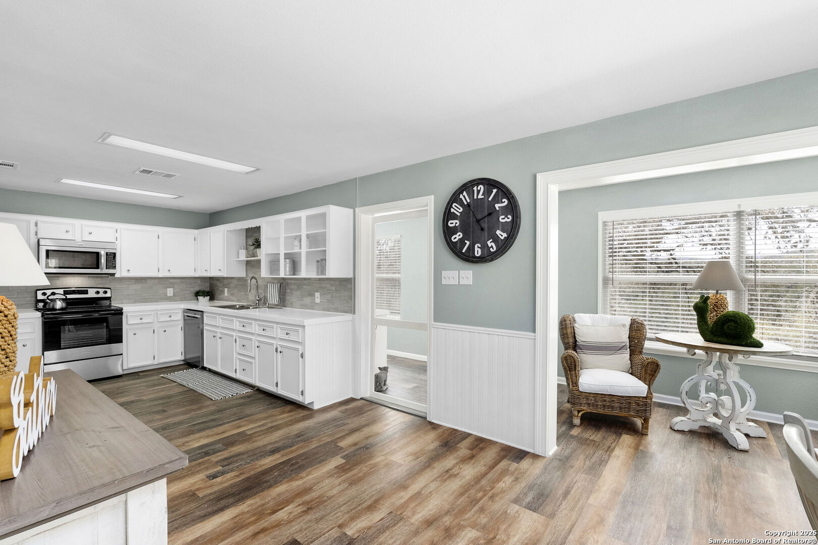 668 Indian Mound Road Tarpley, TX 78883 - Photo 23 of 50 a kitchen with a refrigerator and a stove top oven